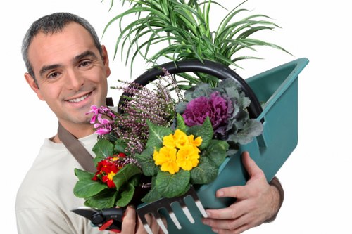 Professional gardeners in Crayford maintaining lawns and borders